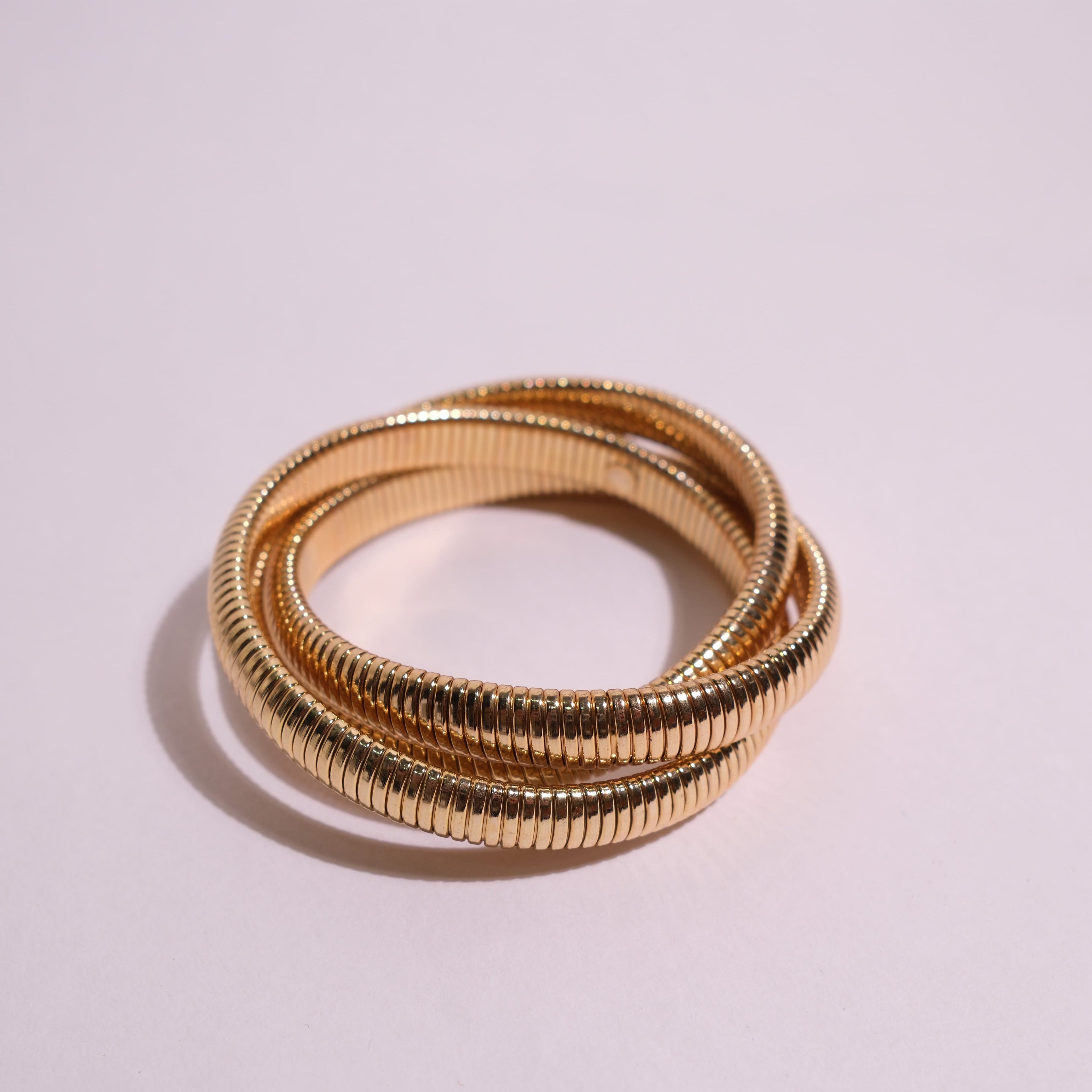 Three Gold Flexible Coil Bangles