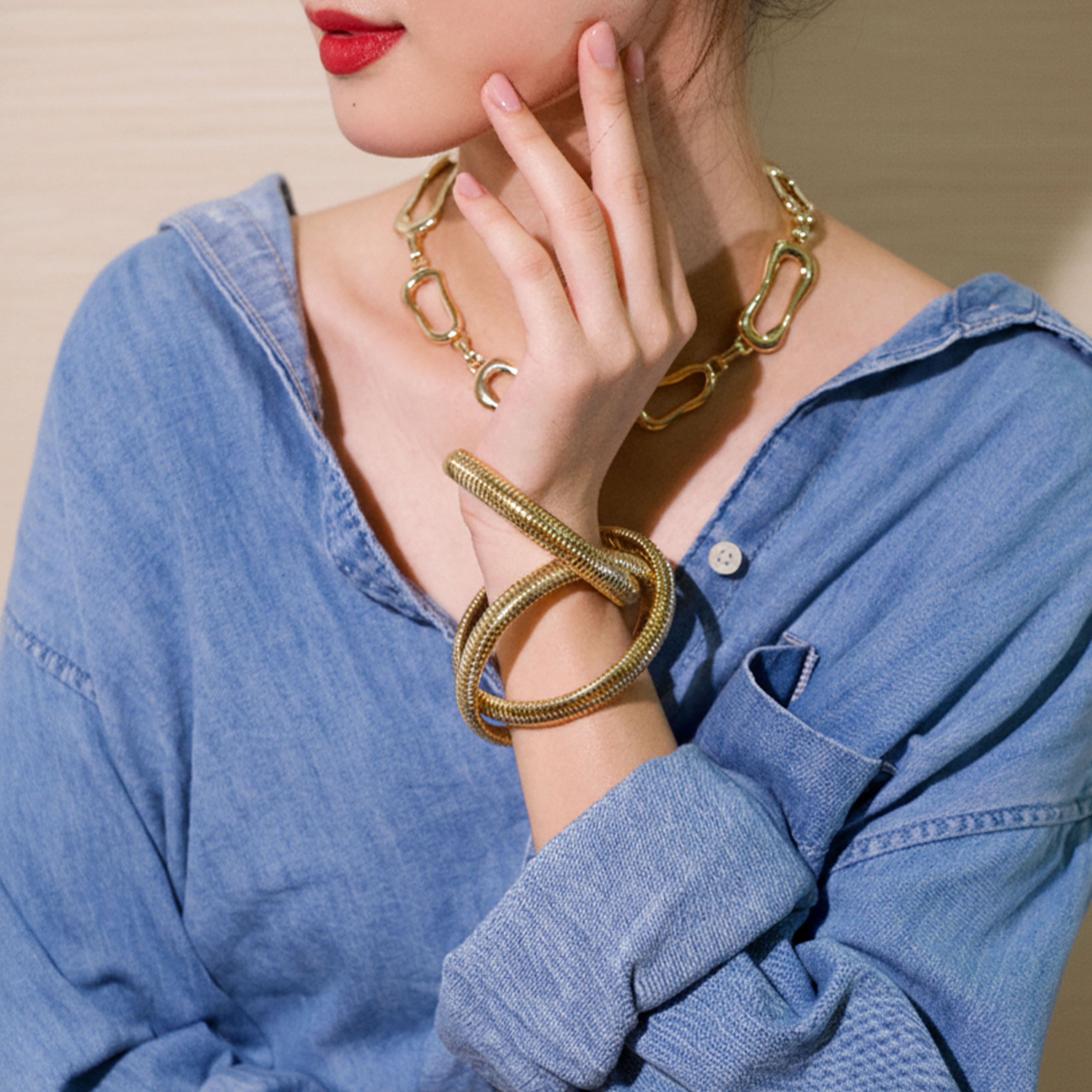 Three Gold Flexible Coil Bangles